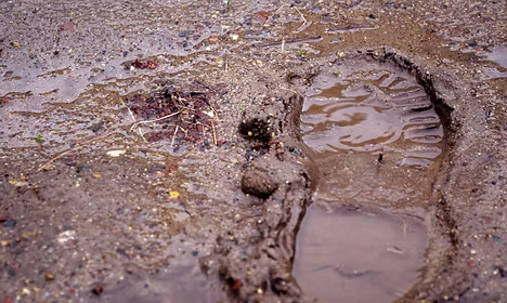 A human footprint pressed into the ground